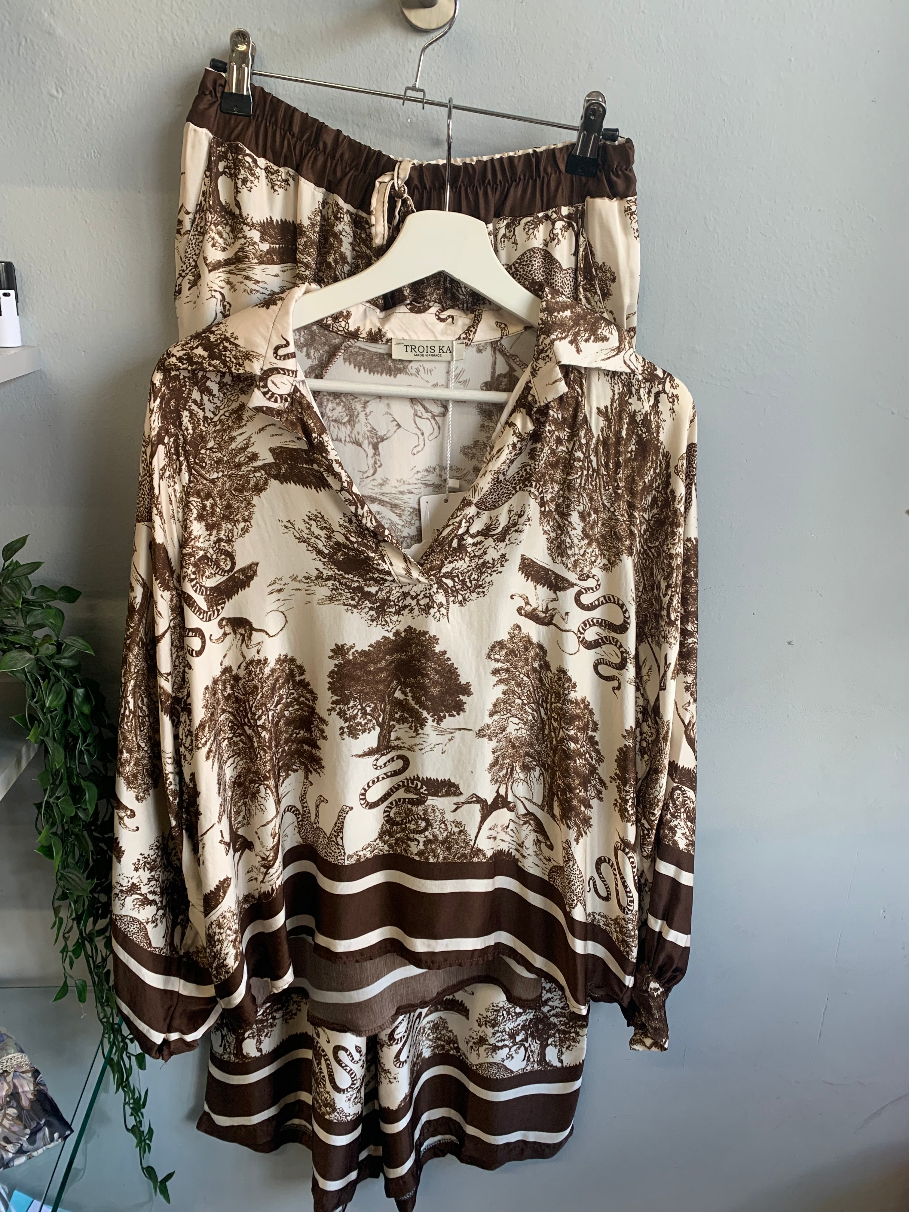 Safari print blouse and trouser set.