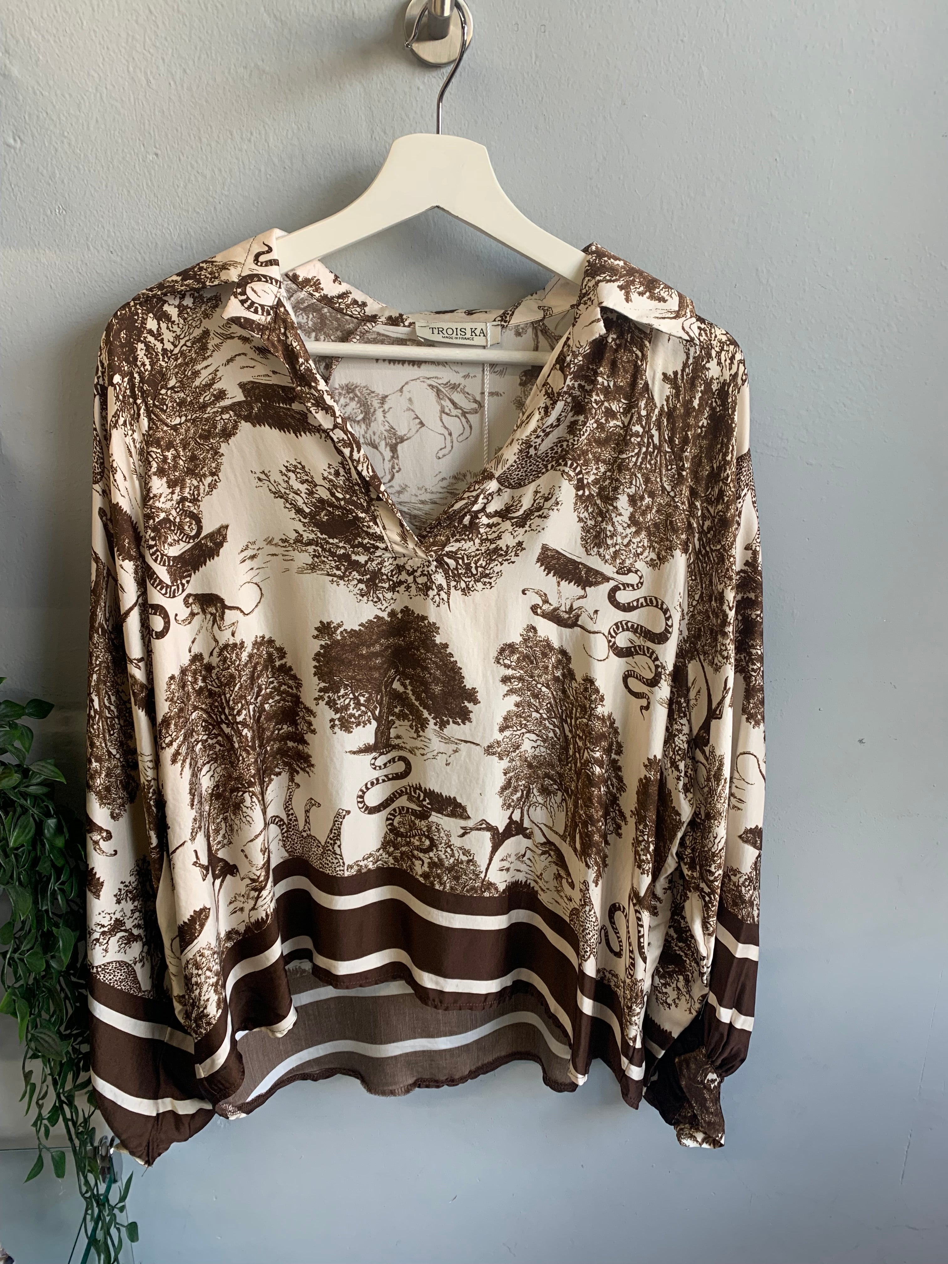 Safari print blouse and trouser set.