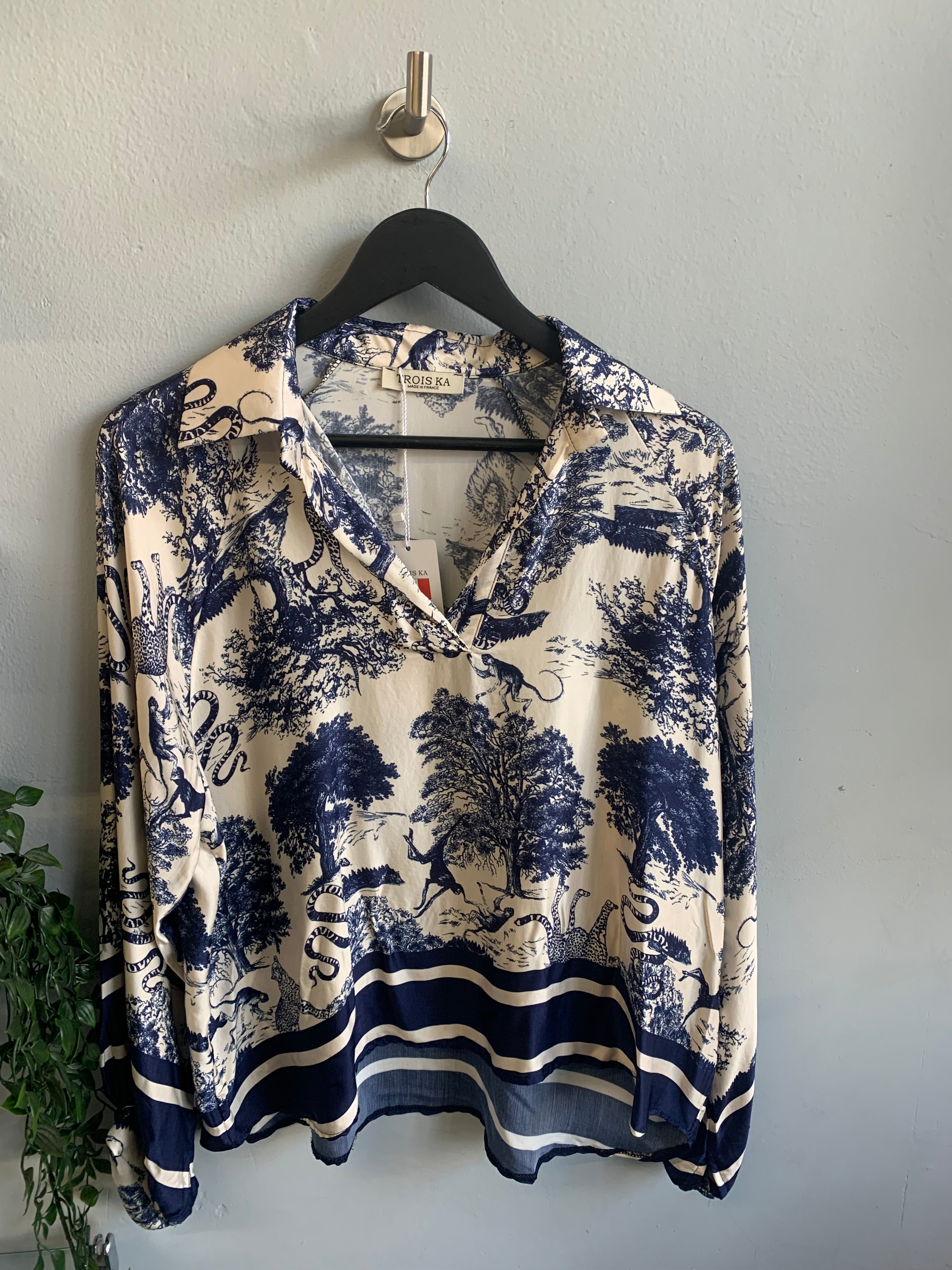 Safari print blouse and trouser set.