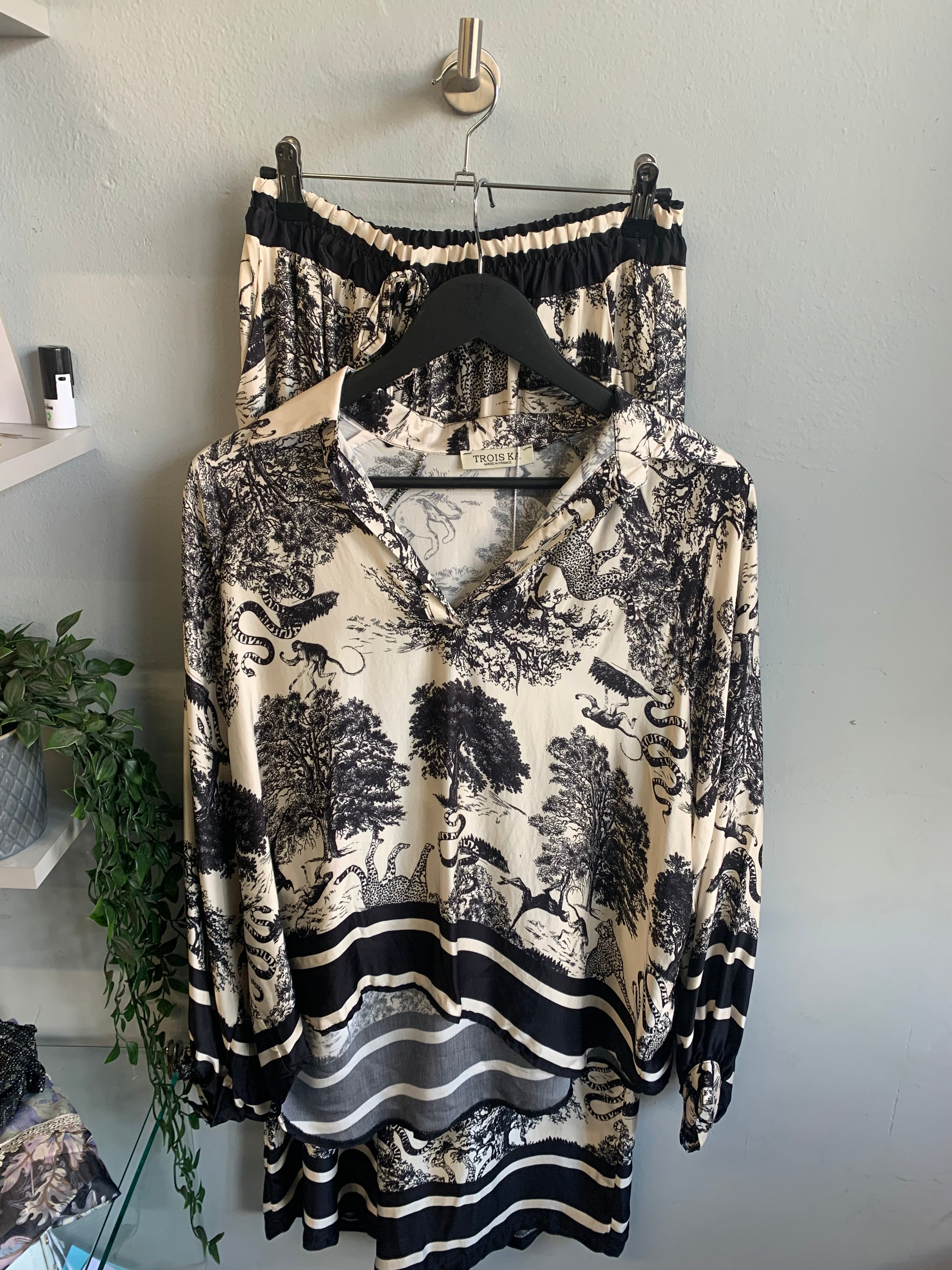 Safari print blouse and trouser set.