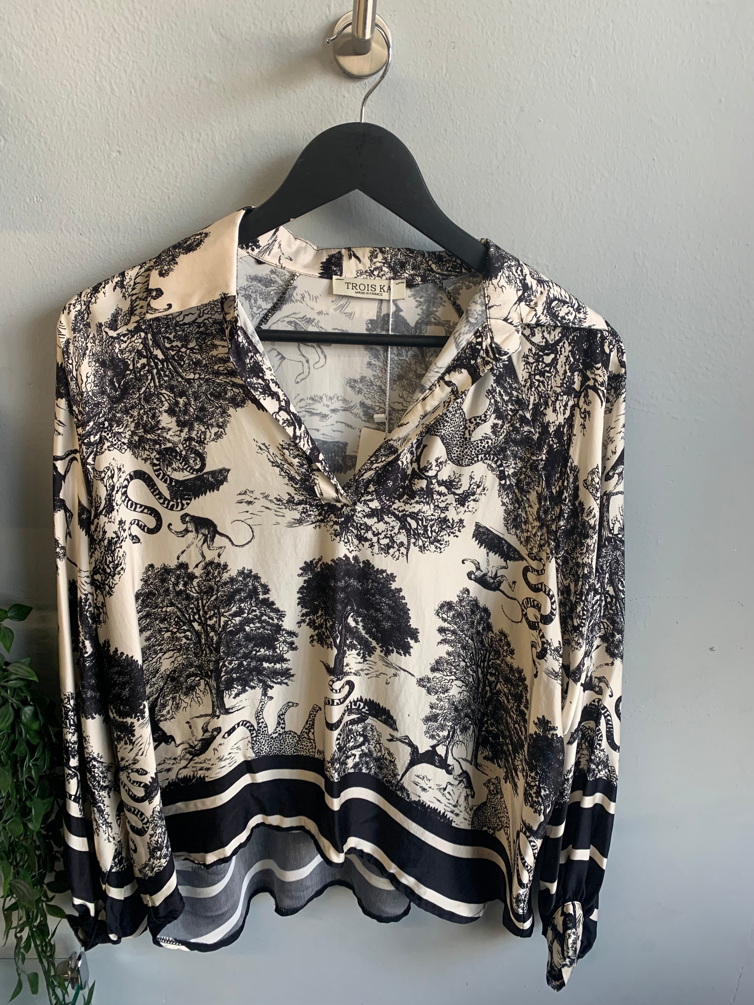 Safari print blouse and trouser set.